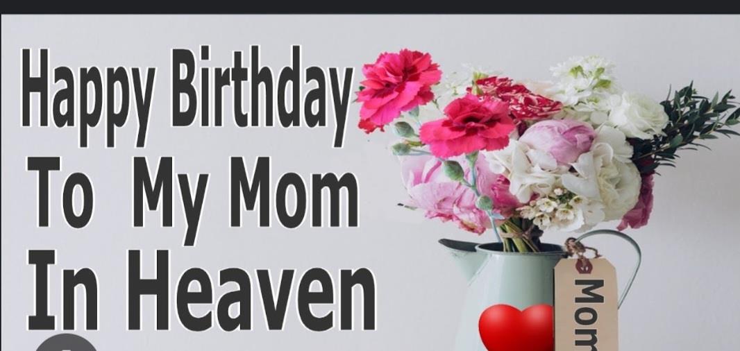 Colorful flowers in a vase honor a mother's birthday and express love in remembrance.