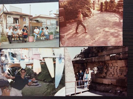 Group of individuals relaxes in a neighborhood while others engage in playful activities outside.