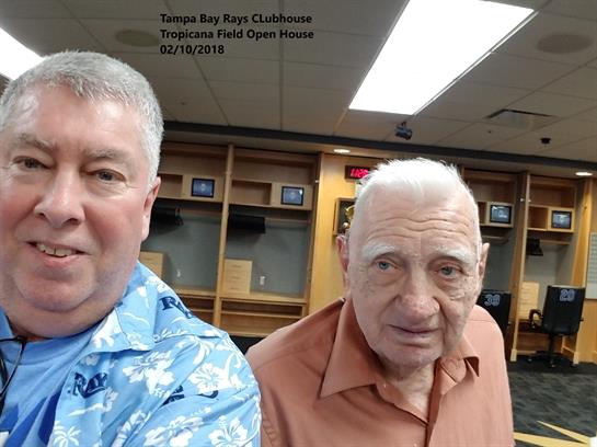 Two men smile for a selfie at the Tropicana Field open house event.