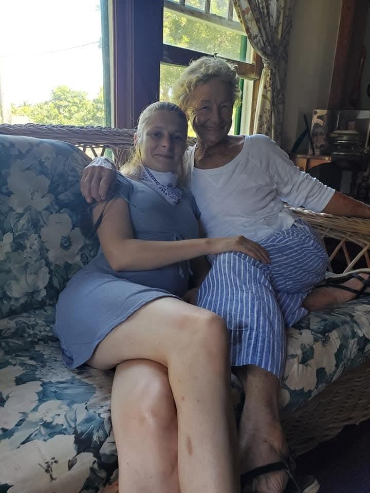 Two women sitting on a couch