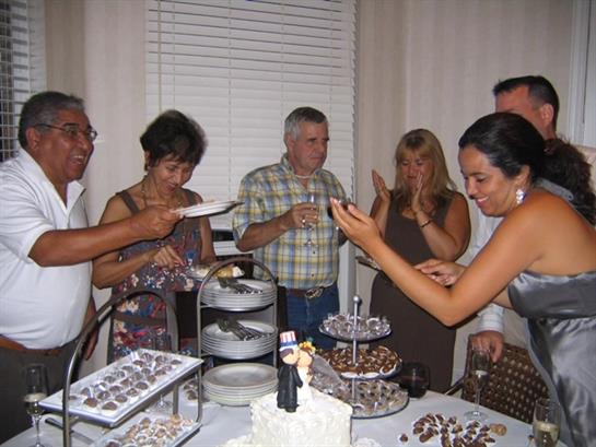 Friends and family enjoy a variety of desserts during a festive celebration at home.