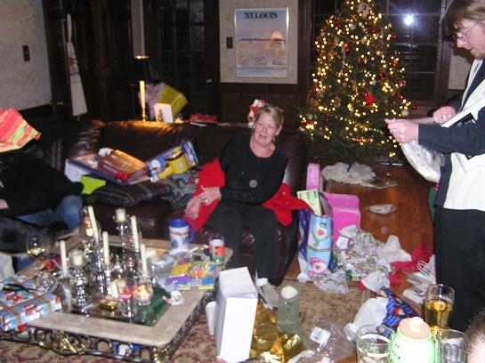 A joyful family celebration filled with decorations, gifts, and a beautifully lit tree.