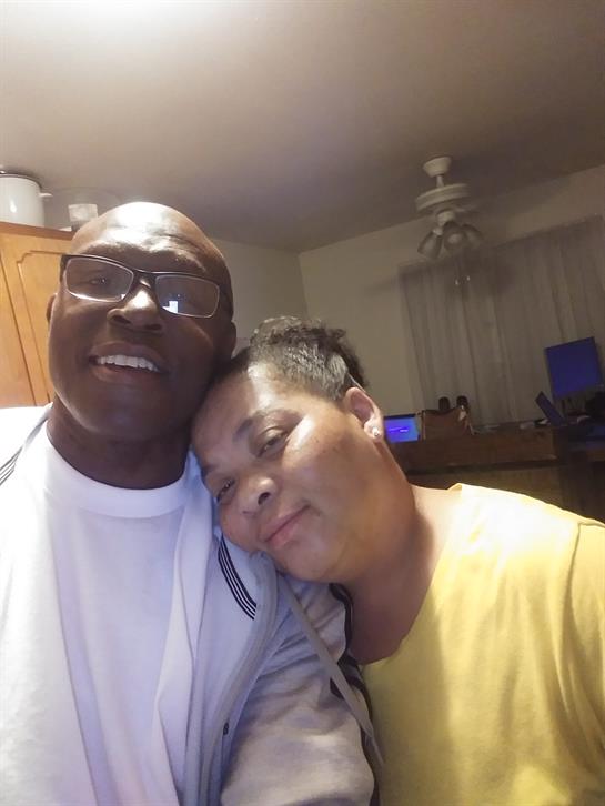 Couple enjoys a warm moment together while relaxing at home in the evening atmosphere.