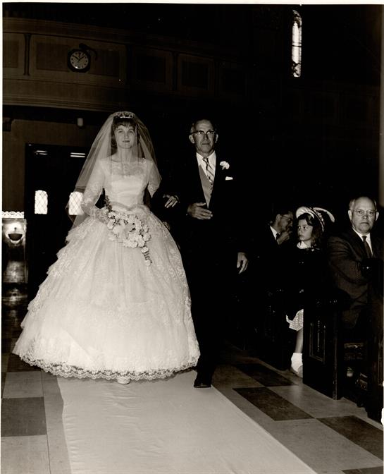 Bridesmaid and groom walk down the aisle, celebrating love in a traditional wedding ceremony.