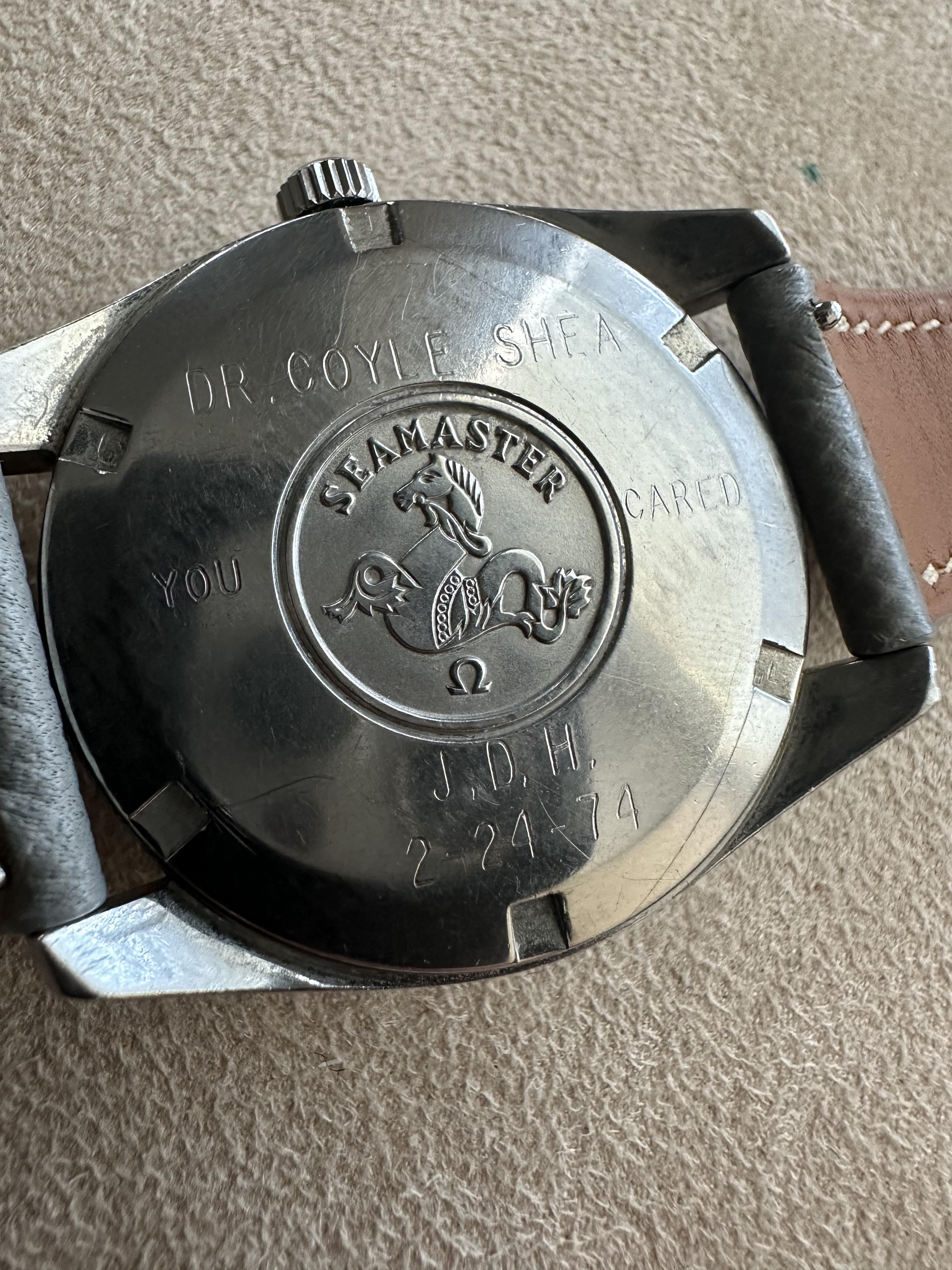 An engraved old watch back with a personal dedication, highlighting fine craftsmanship.