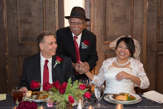 Guests celebrate with a joyful dinner at the wedding reception, full of laughter and love.