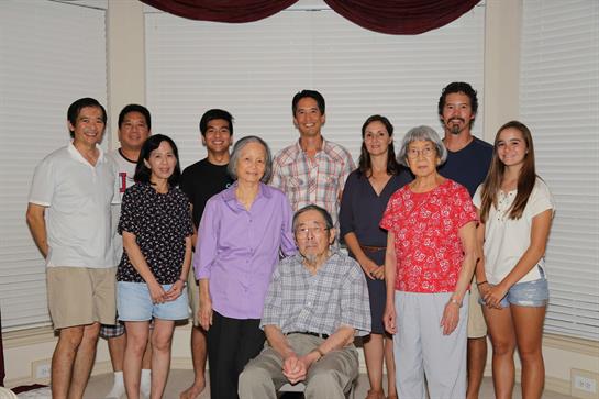 A joyful family gathering fills the living room with laughter and love.
