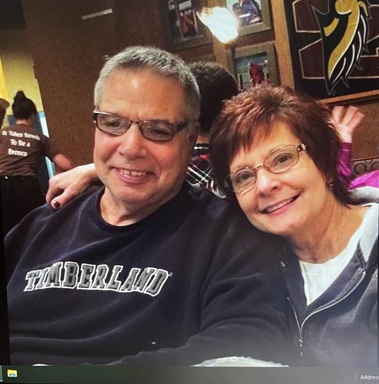 Comfortable atmosphere fills the restaurant as a couple shares laughter and warmth.