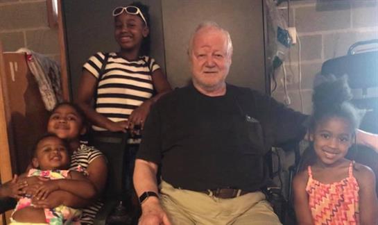 Friends gather in a cheerful atmosphere, sharing laughter and moments together in casual clothes.