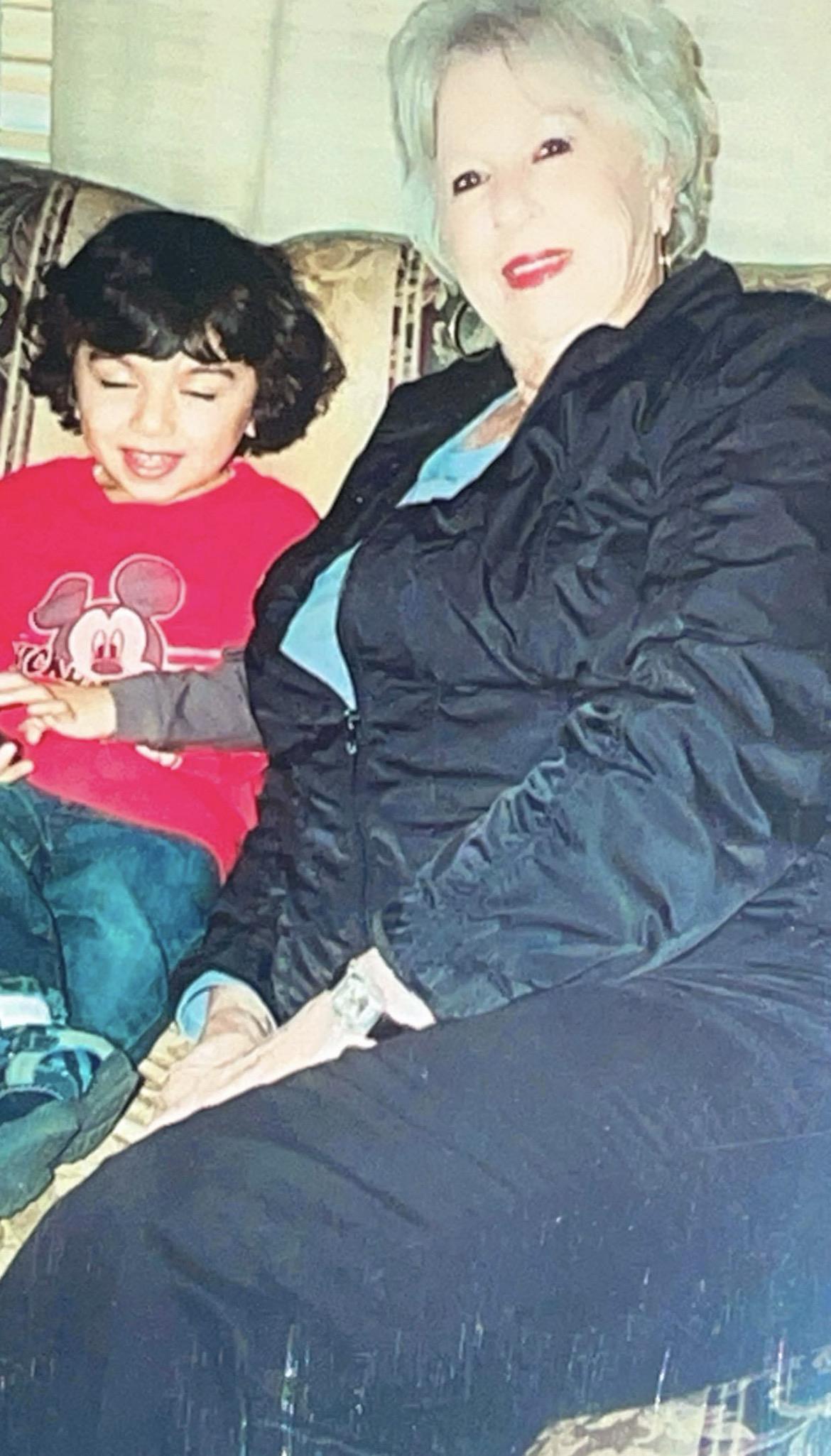 A woman and child sitting on a couch