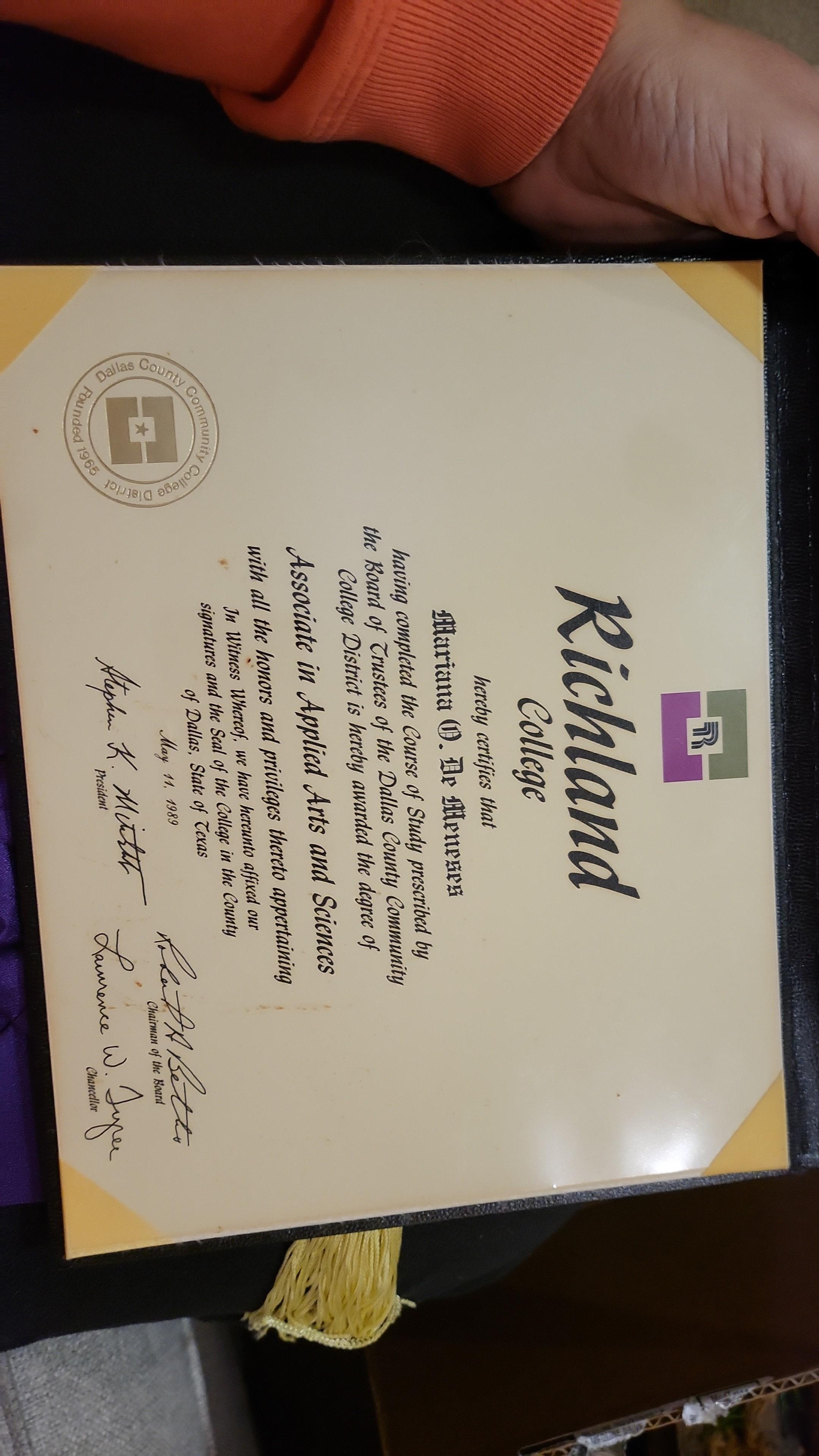 Richland College awards diplomas with graduation cords and tassels to mark achievement.