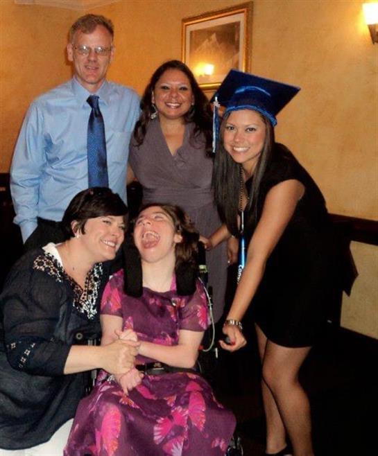 Friends and family gather to celebrate a graduation, showcasing joy and togetherness.