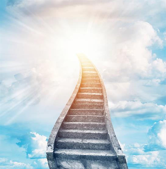 A winding staircase ascends towards a radiant light in a clear blue sky, evoking a sense of hope.