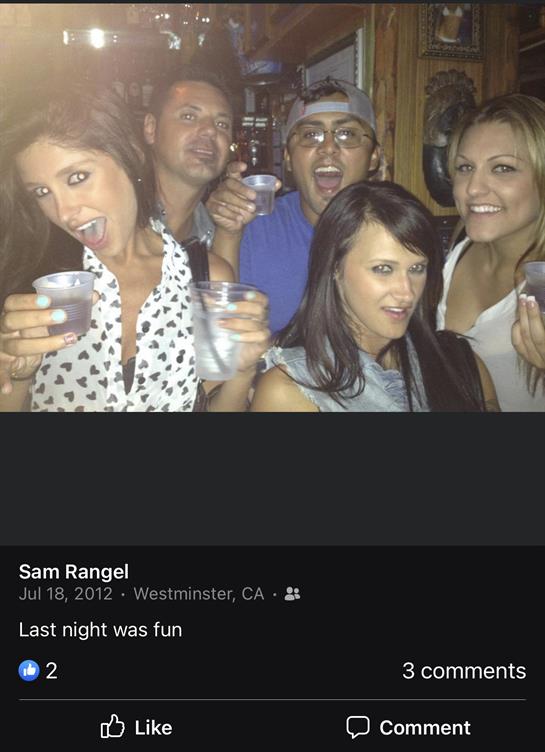 Group of friends joyfully enjoying drinks at a bar in Westminster, California.