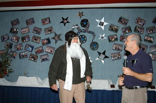 Attendees participate in a festive gathering, showcasing costumes and interacting enthusiastically.