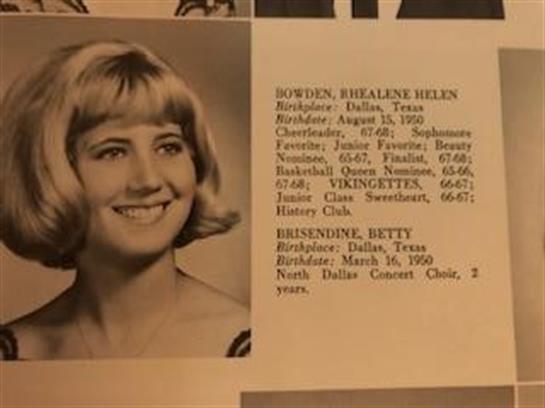 A student smiles for her senior yearbook photo, capturing Dallas high school life.