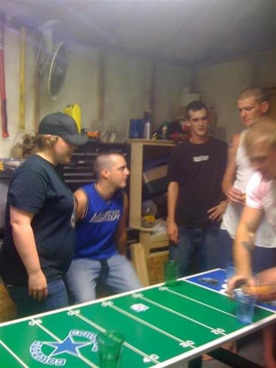 Group of friends engaged in a lively game while enjoying each other's company and laughter.