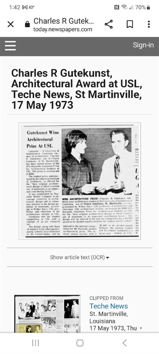 A student receives an architectural award from a faculty member during a ceremony in May 1973.