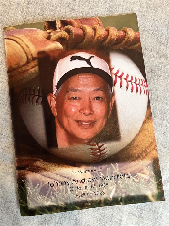 A tribute card showcases a smiling man surrounded by baseballs and gloves, celebrating his life.