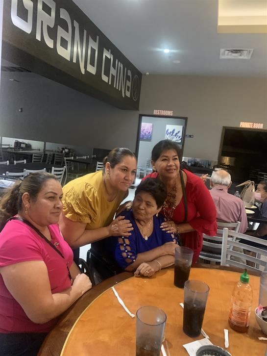 A group of women sitting at a table