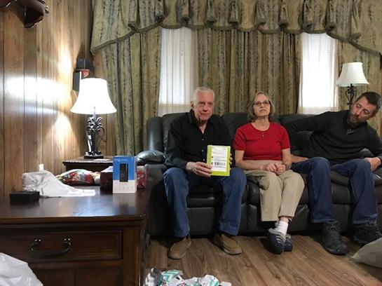Friends gather in a cozy living room, sharing stories and laughter during a calm afternoon.