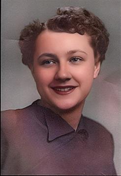 A young woman smiles in a vintage portrait that showcases her charm and beauty.