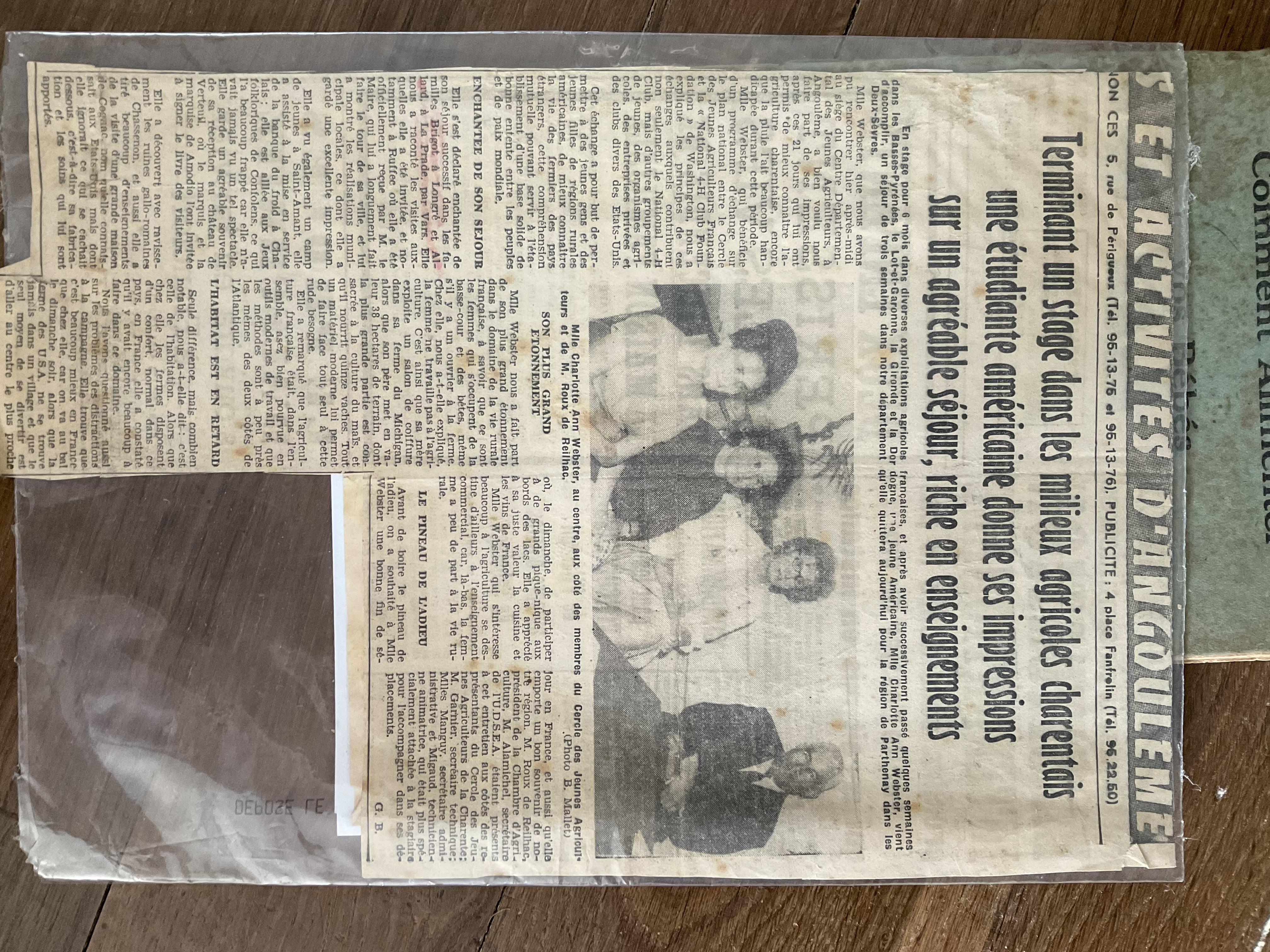A newspaper with a group of people in it