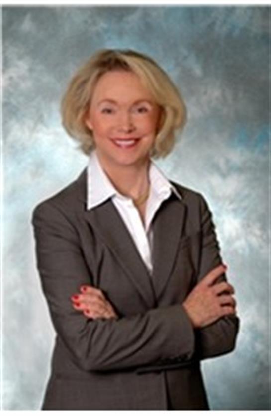 Businesswoman confidently showcases professionalism and approachability in a studio.