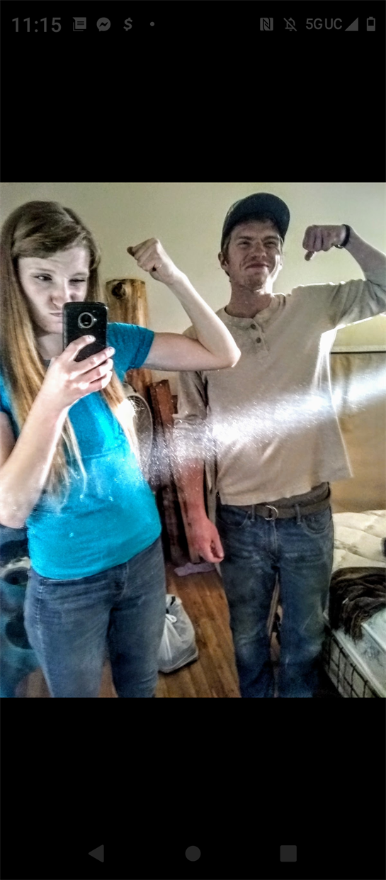 A man and woman taking a selfie
