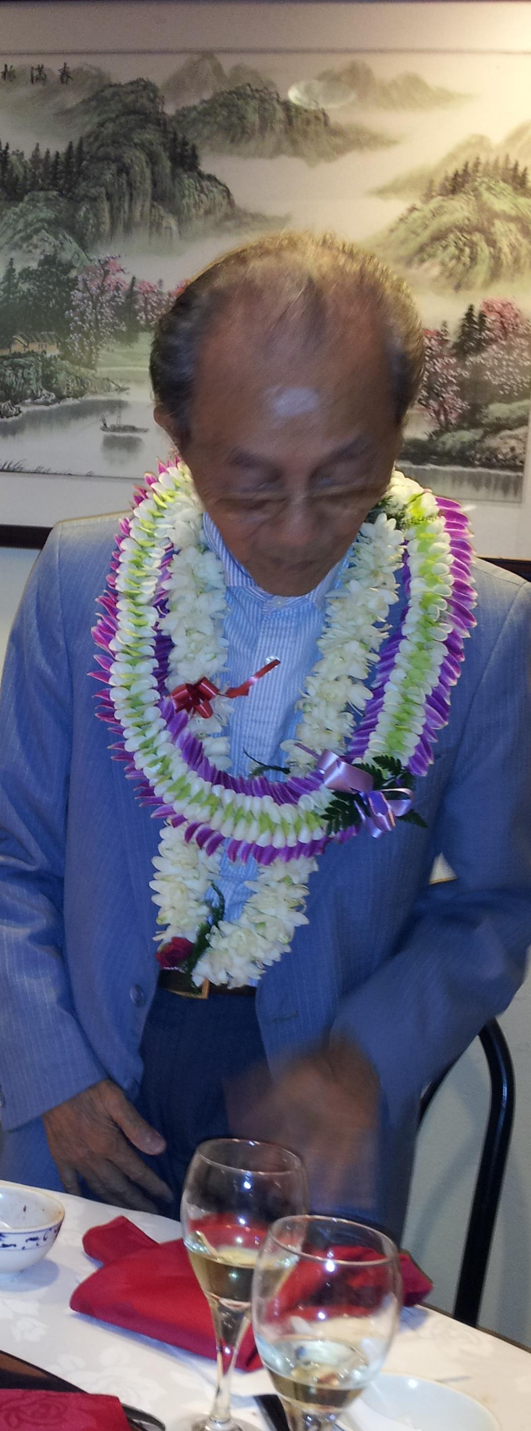 A man wearing a flower lei