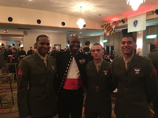 Four military members pose together at a formal event, showcasing camaraderie and service pride.