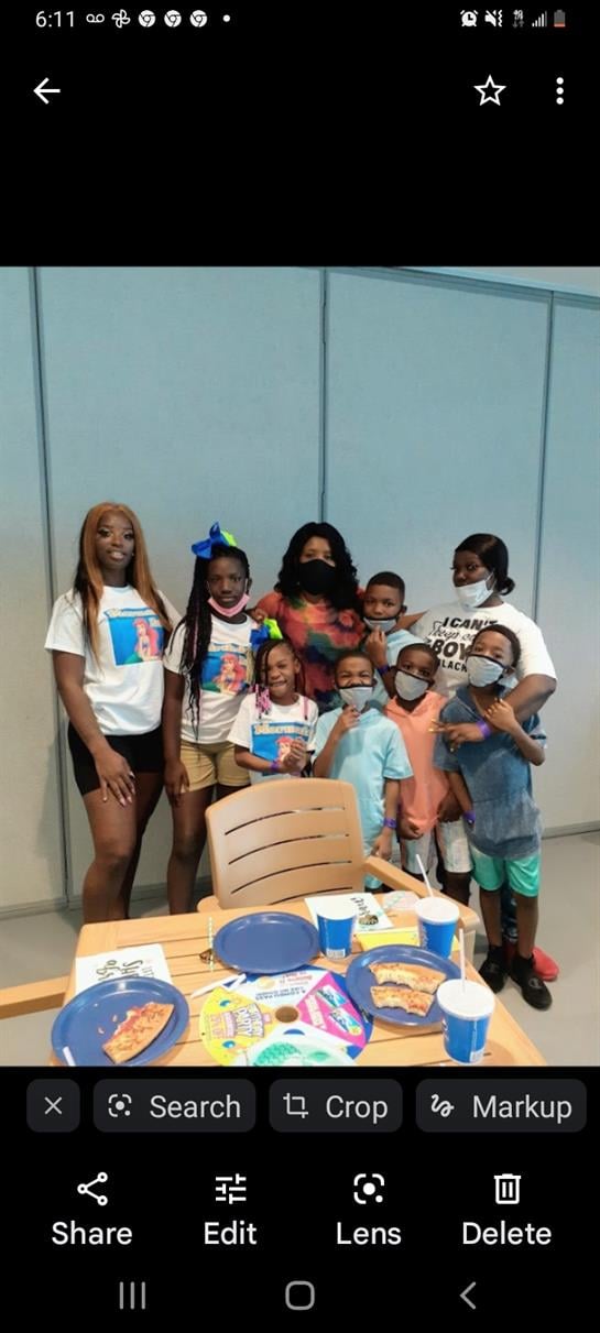 A joyful gathering of kids and adults celebrating together in a happy community space.