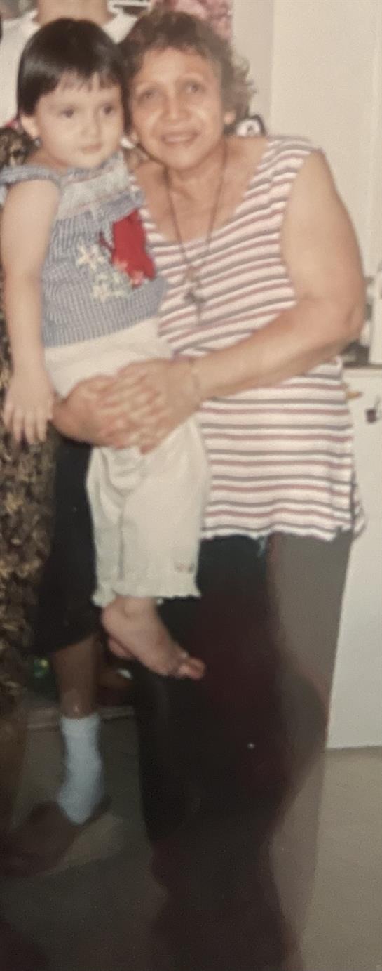 Three family members share a loving moment, highlighting togetherness at home.