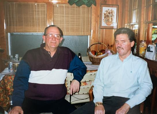 A couple of men sitting in a room
