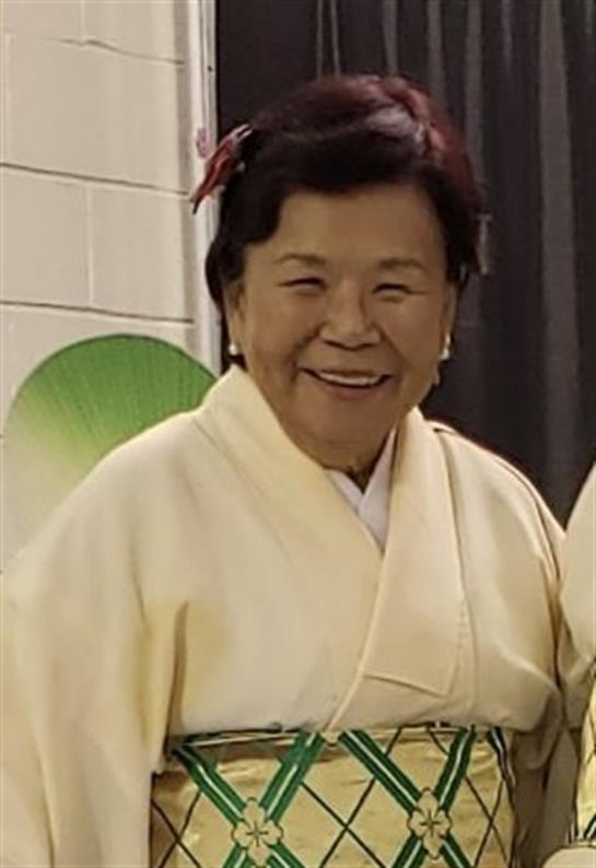 A woman in a white robe