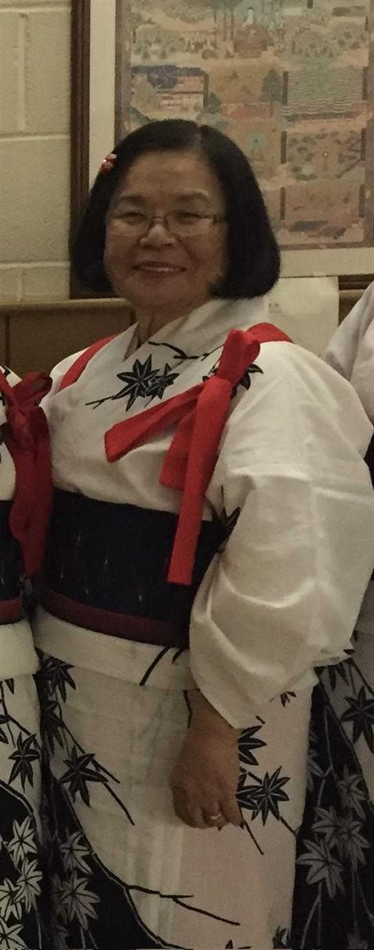 A person wearing a white and red kimono