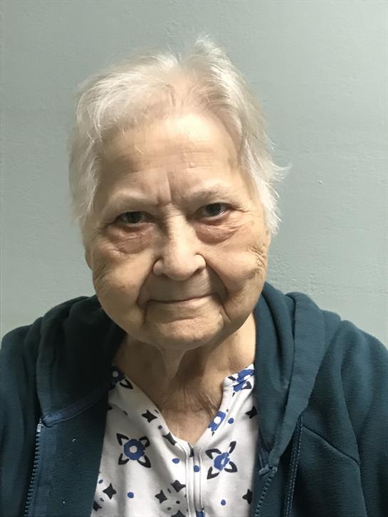 An old woman smiling for the camera