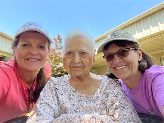 A group of women smiling for a picture