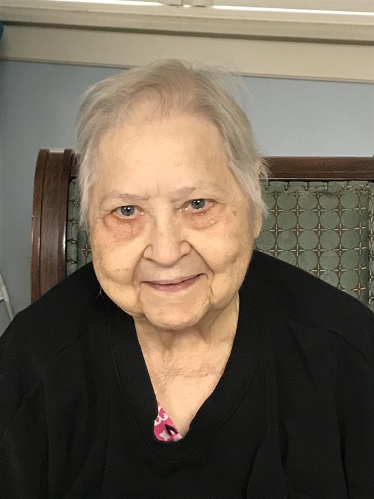 An old woman smiling for the camera