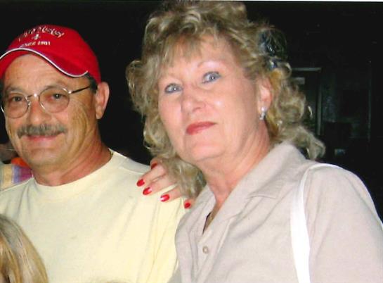 A couple enjoys a night out together, embodying happiness and connection in a casual environment.