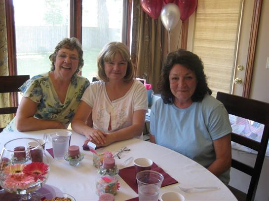 A group of women sitting at a table