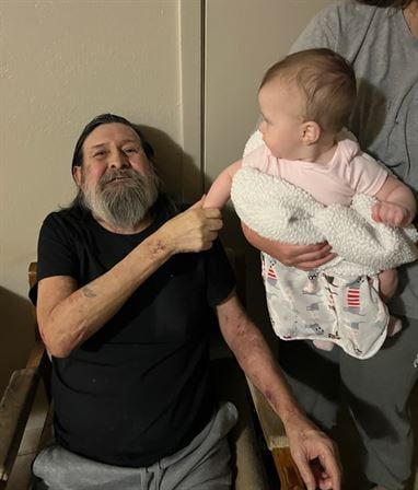 A man holding a baby