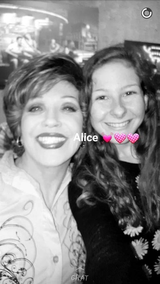 Two friends smile and pose together during a joyful celebration, sharing a heartfelt connection.