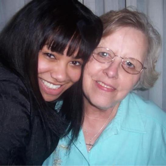 A woman and a woman smiling