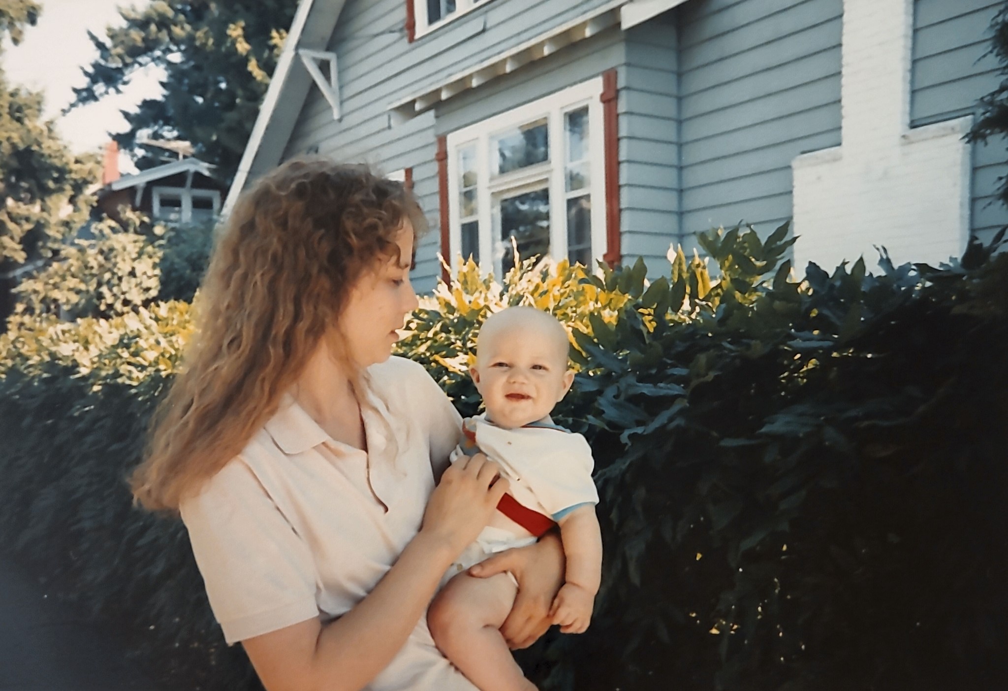 A woman holding a baby