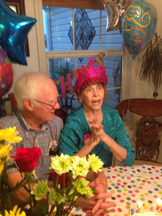 Friends and family gather to celebrate a milestone during a lively evening filled with joy.