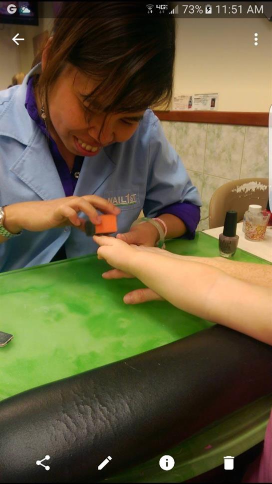 A woman getting her nails done