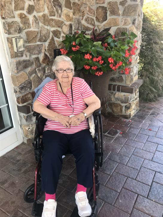 An old woman in a wheelchair