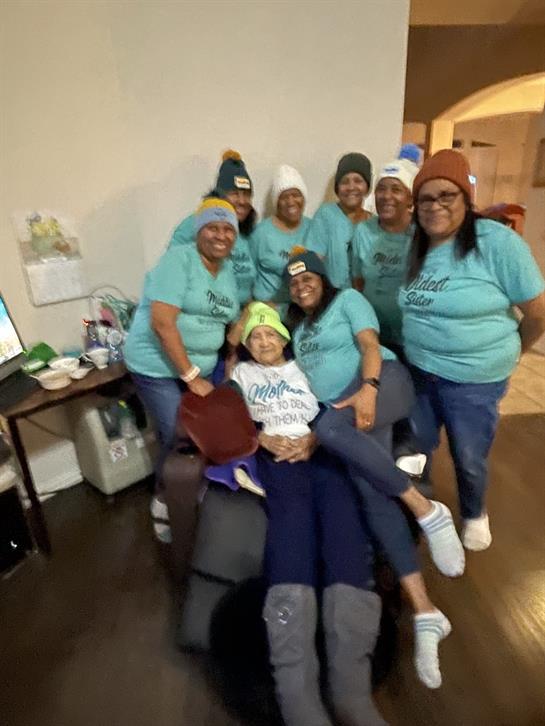 A group of women wearing matching outfits
