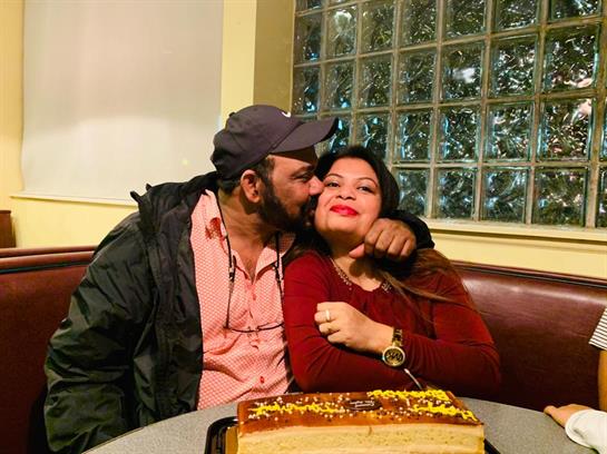 A man kissing a woman on the cheek